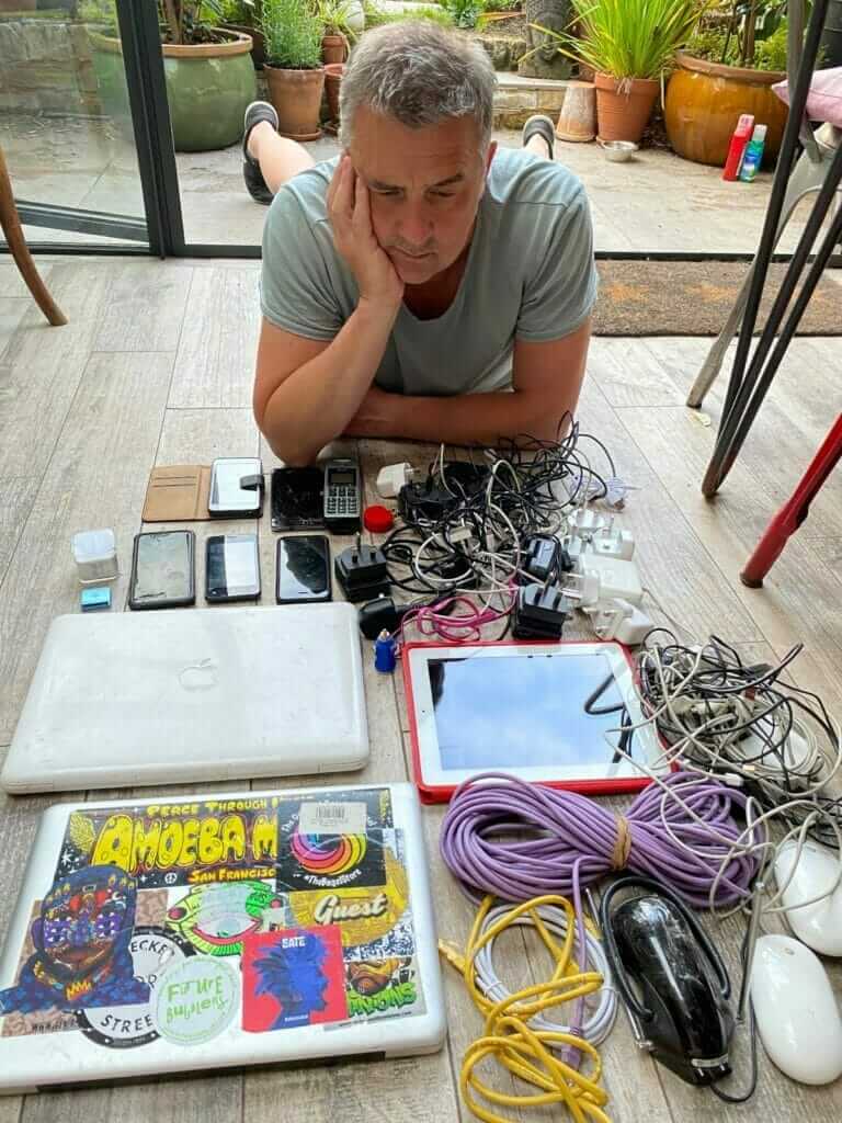 man with collction of unwanted electricals