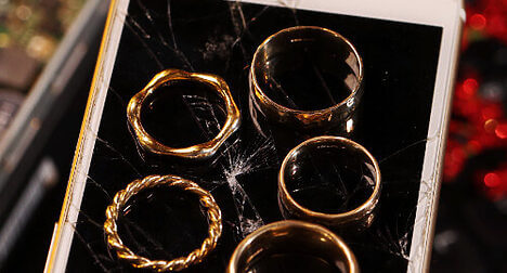 Gold rings placed on a mobile phone