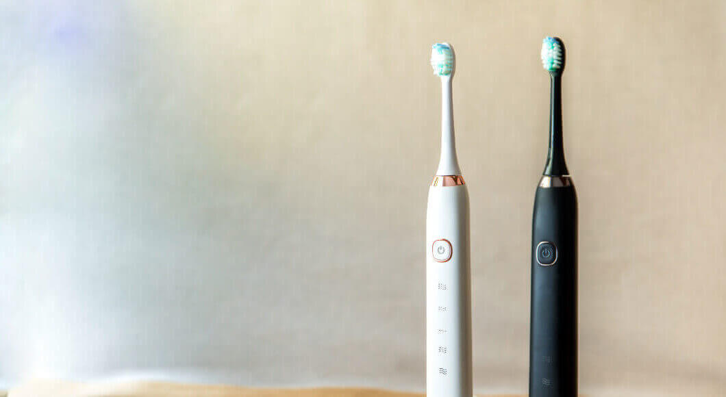 two electric toothbrushes