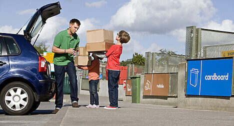 family at recycling centre