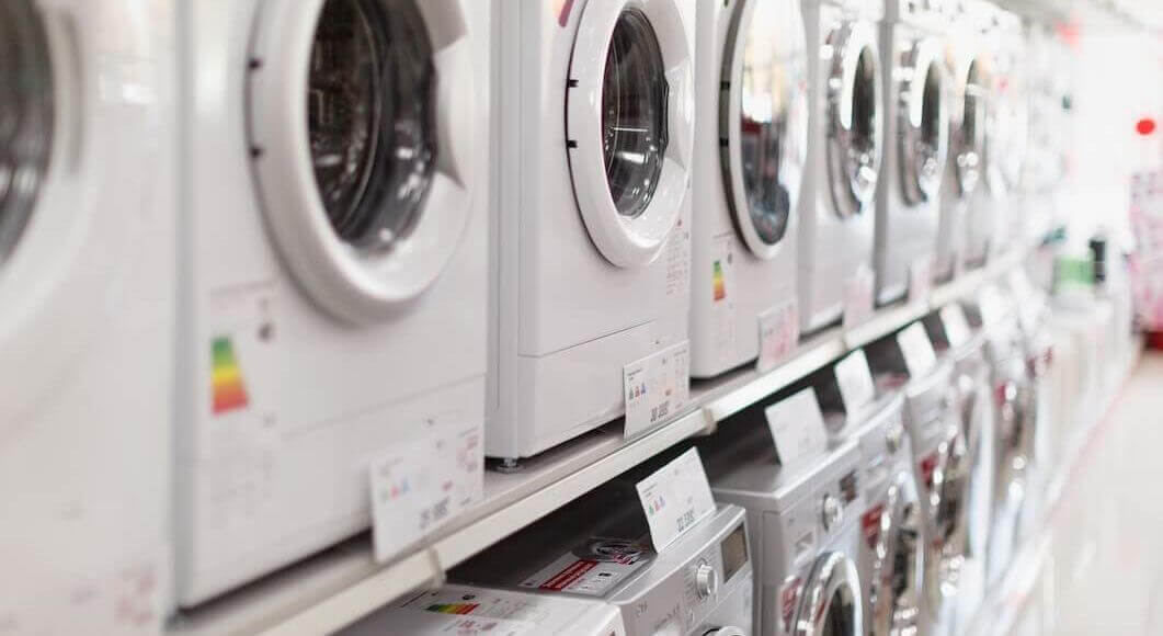 washing machines lined up in a store