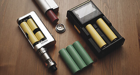 vapes and batteries on table