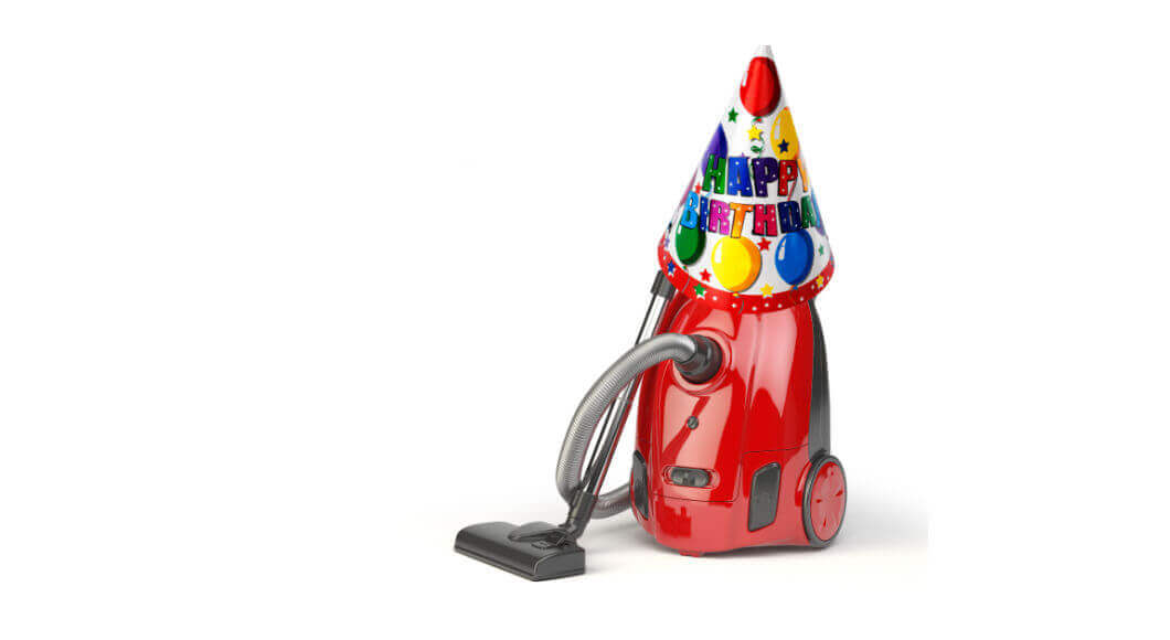 a vacuum cleaner with a party hat on