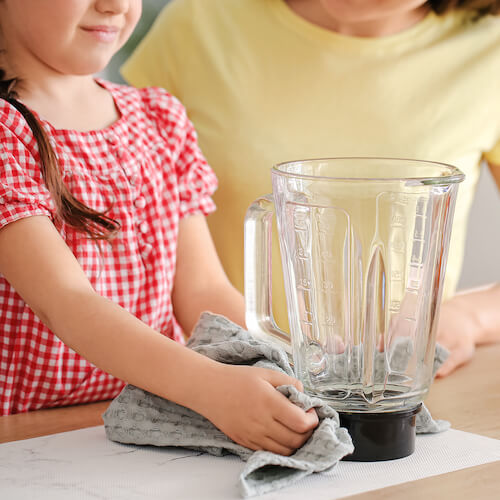 child & woman with blender