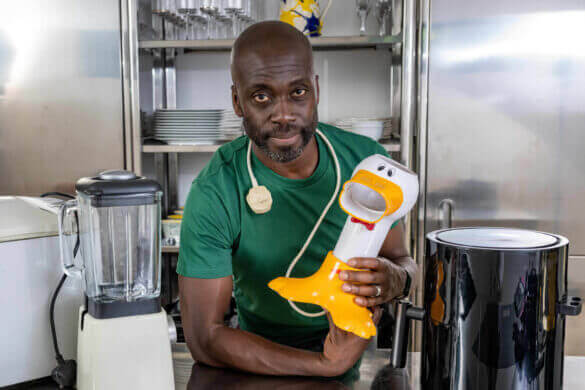 Orits Deley holding a popcorn maker as part of Recycle Your Electricals FadTech campaign