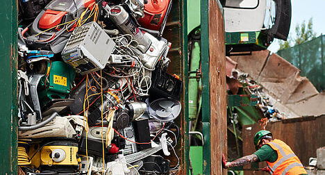 Worker at electrical recycling centre