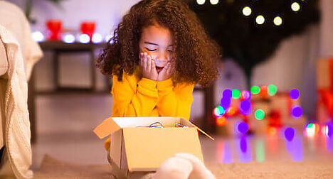 child opening surprise box