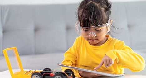 young student learning about electronics
