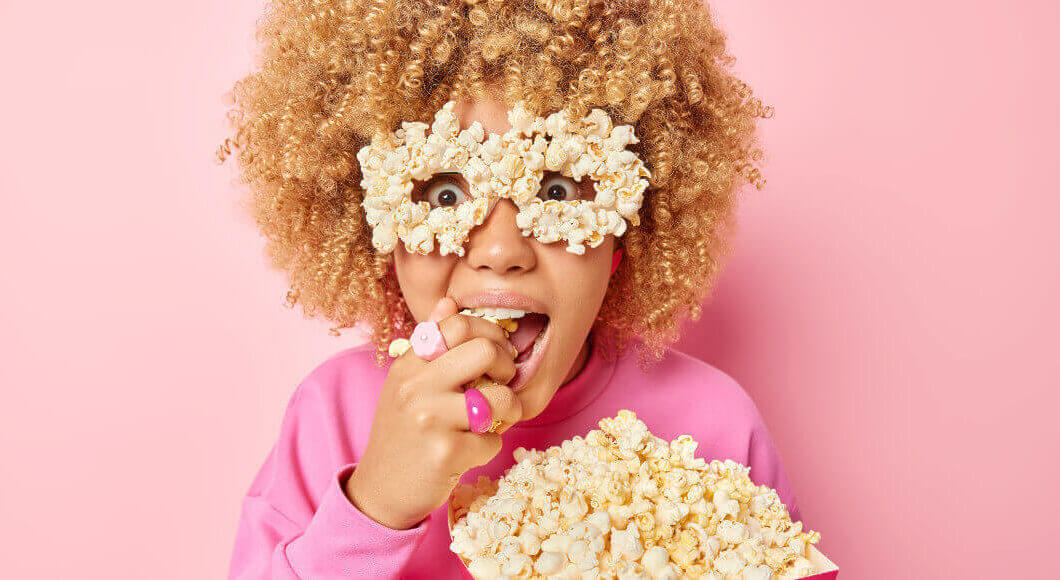 woman eating popcorn