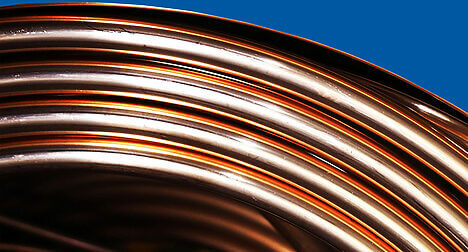 a close up of a roll of copper pipe