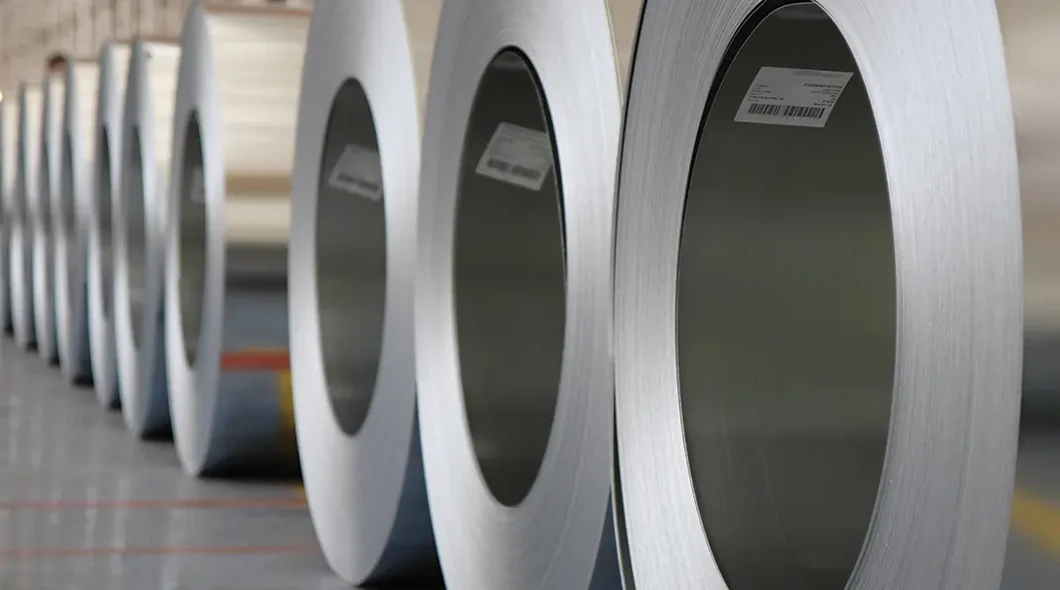 Close up of rolls of zinc sheets, lined up in a row.