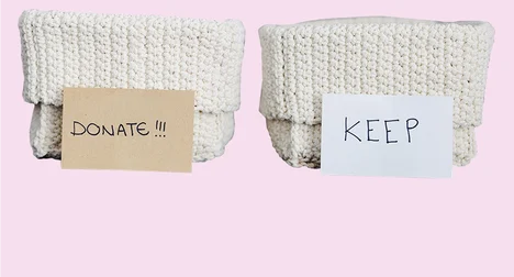 donate & keep containers for recycling electricals made of wool against a pale pink background